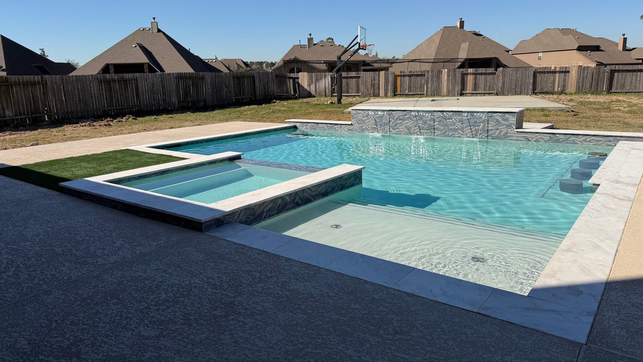 Completed outdoor living and pool environment in North Houston