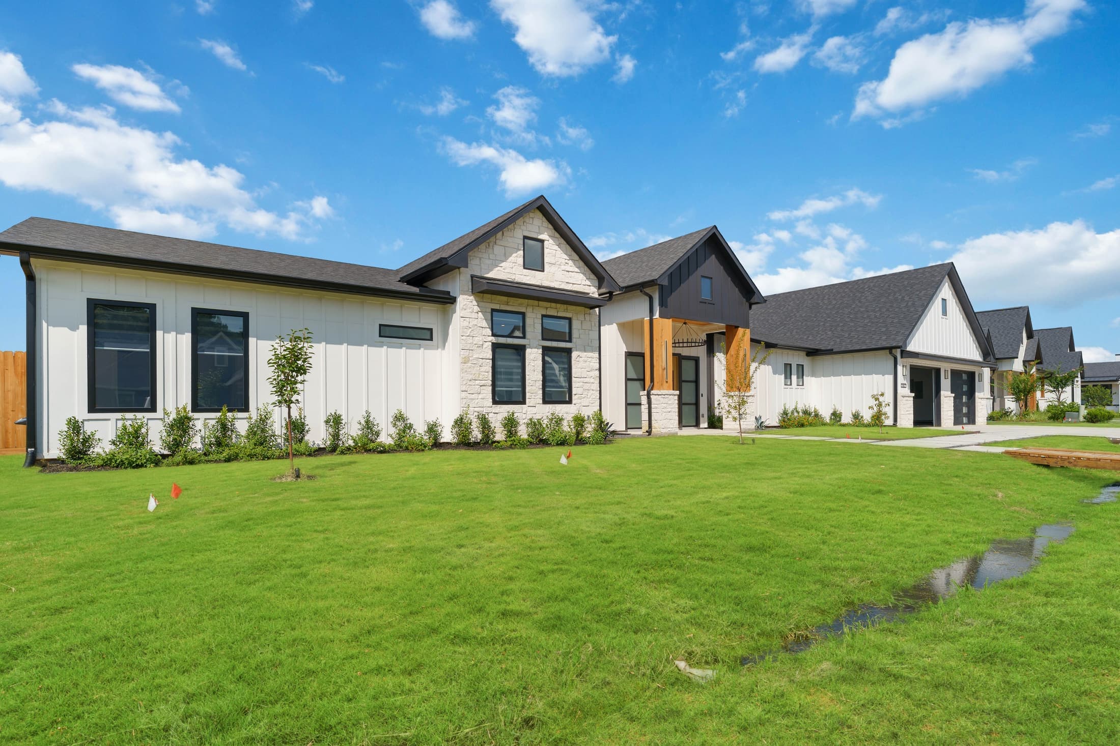 Luxury custom home exterior in a wooded residential setting